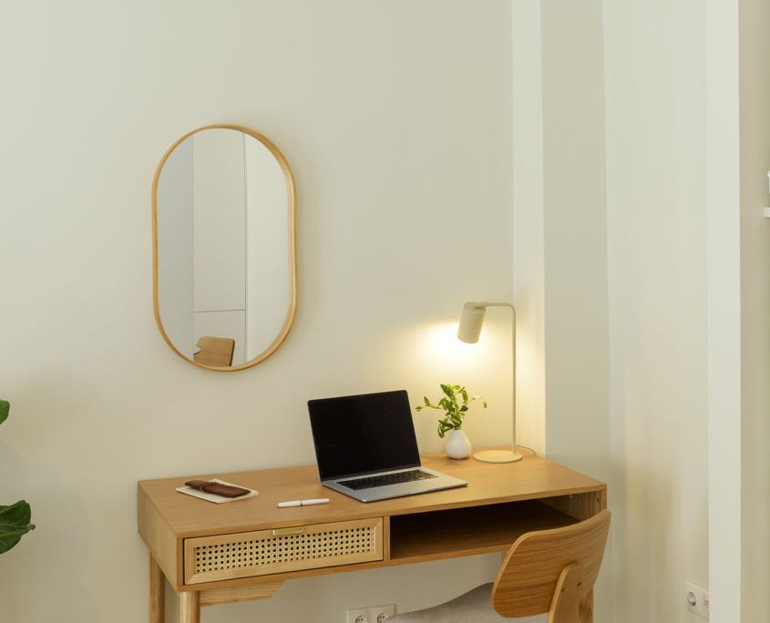 Dedicated workspace with desk, comfortable chair and multiple power outlets in furnished long stay apartment in Ano Petralona, Athens