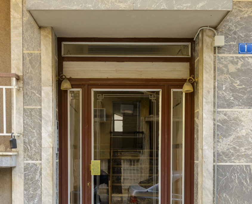 Entrance of a fully furnished long stay apartment building in Ano Petralona, Athens near Filopappou Hill